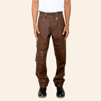 Brown cargo pants worn by a person on a beige background