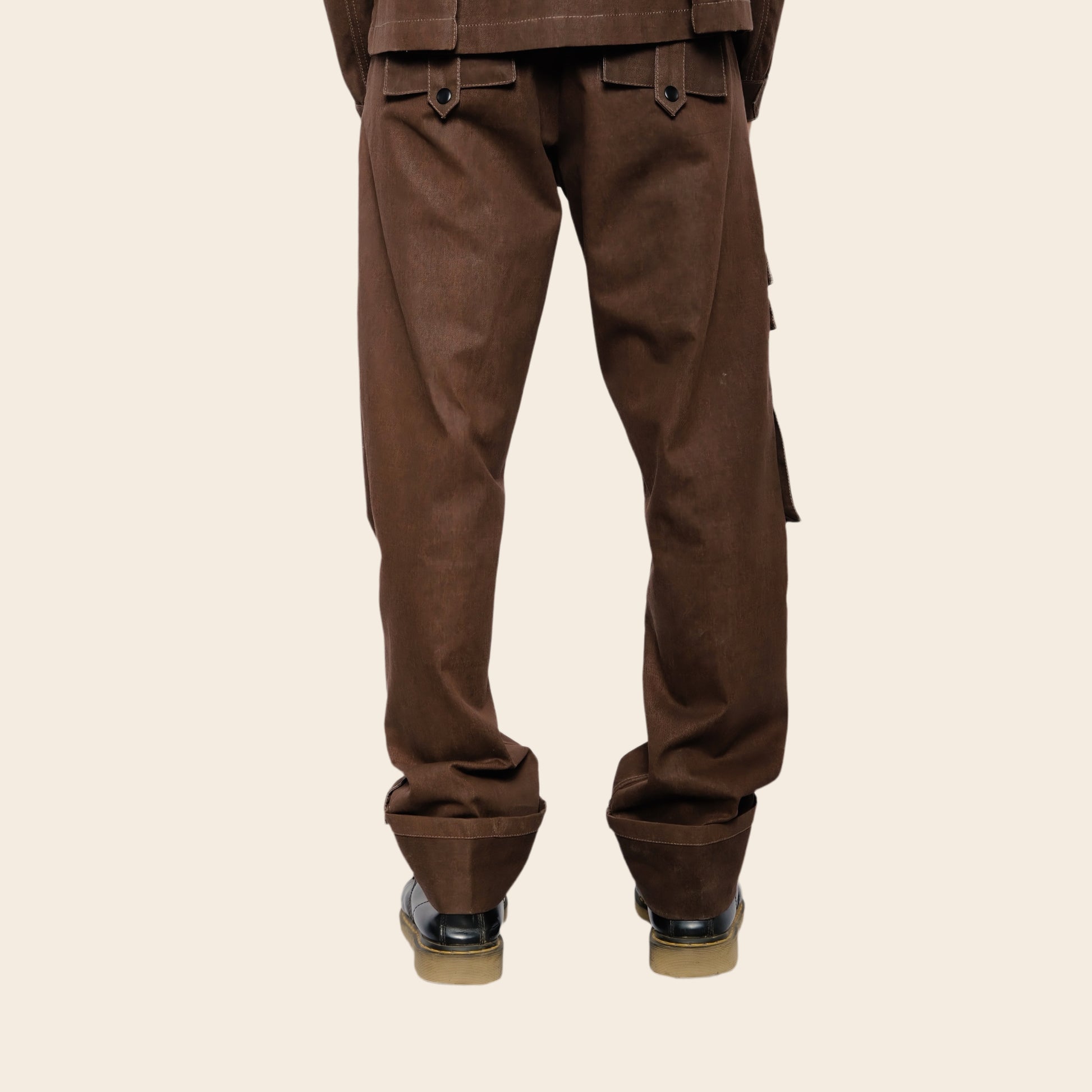 Brown cargo pants on a beige background