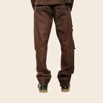 Brown cargo pants on a beige background